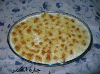صينية البطاط بالكريمة بعد دخوله الفرن.jpg